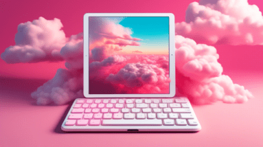 A white iPad Pro with a Magic Keyboard levitating in a surreal pink cloudscape with oversized colorful computer keys floating around it.